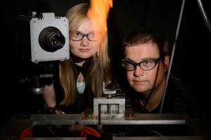 Michael Renfro, Associate Professor of Mechanical Engineering, and Victoria Kallsen '15 (ENG) observe a flame experiment on June 26, 2013.