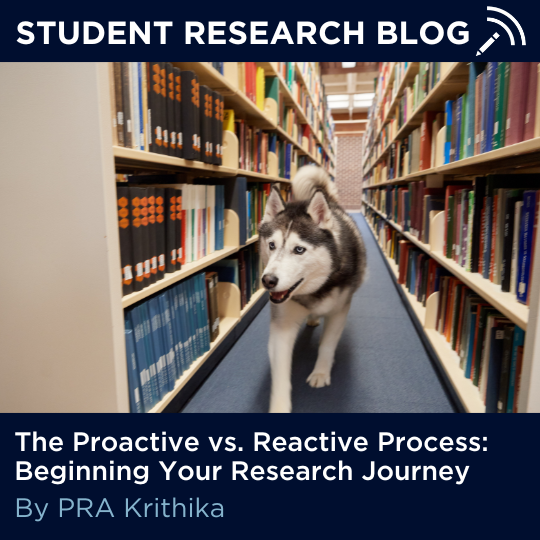 Picture of Jonathan the Husky in the UConn Storrs library with text: "Student Research Blog: The Proactive vs. Reactive Process: Beginning Your Research Journey, By PRA Krithika." with link - https://ugradresearch.uconn.edu/2025/03/20/proactive-reactive/.