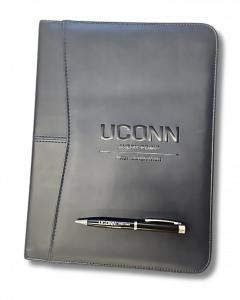 Picture of the notebook and pen given out to students participating in the First Generation Favors Leadership Dinner at the Avery Point campus