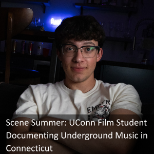 Evan Elmore in a dark theater with text: Scene Summer: UConn Film Student Documenting Underground Music in Connecticut - link: https://today.uconn.edu/2025/07/scene-summer-uconn-film-student-documenting-underground-music-in-connecticut/.